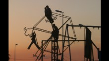 Kurdish children play on a broken ferris wheel in Mosul, a month before the invasion of Iraq in 2003.