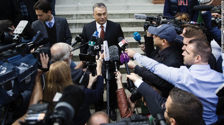 Hungarian Prime Minister Viktor Orban speaks to media after casting his vote.
