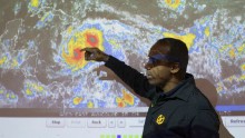 Emergency Operation Center officials in Santo Domingo, Dominican Republic, monitor Hurricane Matthew on Monday as it moves slowly through the Caribbean Sea.