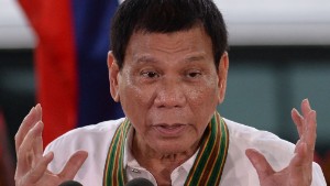 Philippine President Rodrigo Duterte gestures as he delivers a speech during a &quot;talk to the troops&quot; visit to meet military personnel in Manila on October 4, 2016.Rodrigo Duterte launched a fresh tirade at the United States on October 4, telling Barack Obama to &quot;go to hell&quot; as the longtime allies launched war games that the firebrand Philippine leader warned could be their last. / AFP / TED ALJIBE        (Photo credit should read TED ALJIBE/AFP/Getty Images)