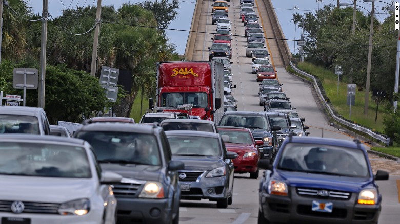 People in vehicles make an evacuation route over 520 bridge heading west from Merritt Island, Fla., Wednesday, Oct. 5, 2016, as Hurricane Matthew approaches Florida. (Red Huber/Orlando Sentinel via AP)