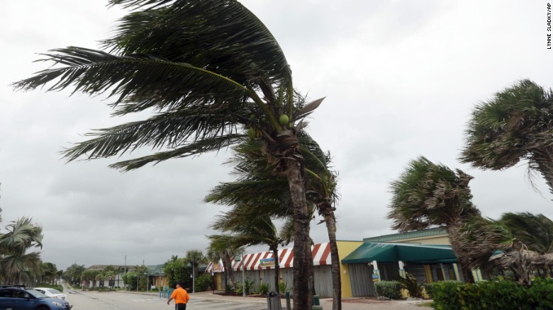 Palm trees sway in high gusts of wind, Thursday, Oct. 6, 2016, in Vero Beach, Fla. Hurricane Matthew continues to make a path for Florida's east coast from the Bahamas. (AP Photo/Lynne Sladky)