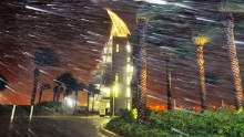 Heavy rain billows in front of Exploration Tower in Cape Canaveral, Florida, on October 7.