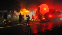 Firefighters respond to a pre-dawn house fire in Satellite Beach, Florida, that was possibly caused by a downed power line on October 7. 