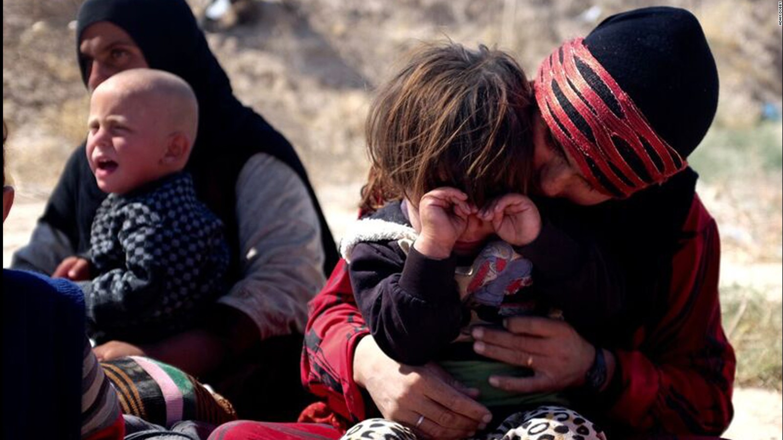 Displaced people arrive in Daqouq. The children are exhausted from the journey; the parents wary of what comes next.