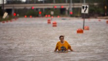 A woman who gave her name only as Valerie walks along flooded President Street after leaving her homeless camp in Savannah, Georgia, on Saturday, October 8. Hurricane Matthew has drenched Florida, Georgia and the Carolinas in recent days as it churned up the Atlantic Coast. As of Sunday morning, the storm had been downgraded to a cyclone and appeared to be heading out to sea.