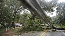 A downed tree and power lines block a road on Georgia's St. Simons Island on October 8.