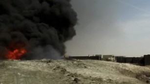 ISIS sets oil wells on fire 