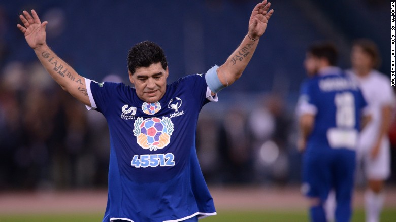 Maradona salutes the crowd as he leaves the pitch.