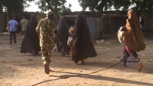 This photo, obtained exclusively by CNN, shows some of the 21 girls who were released to the Nigerian military Thursday morning in Nigeria.