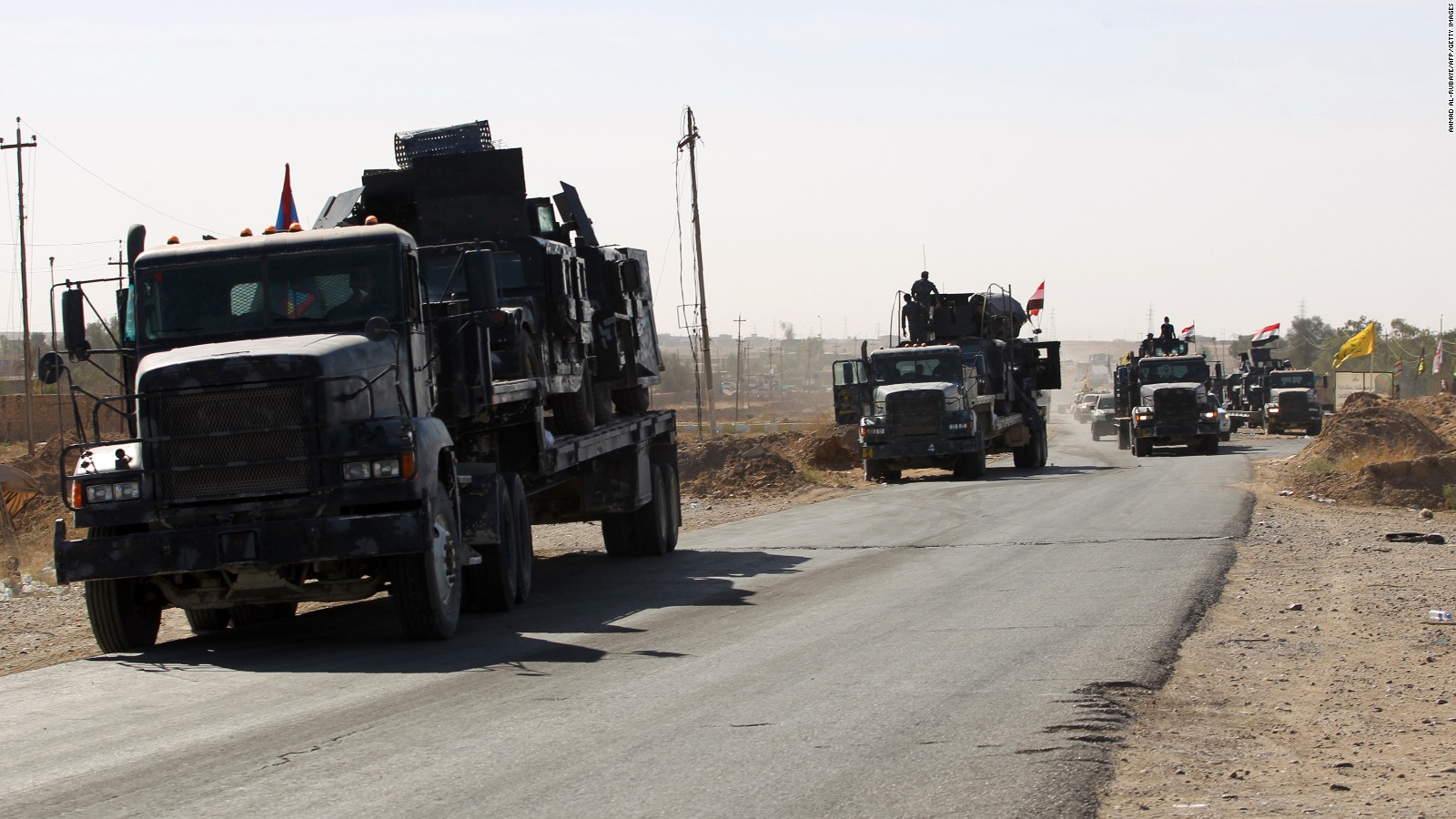 Iraqi forces gather at the Qayyarah military base, about 35 miles south of Mosul, on Sunday, as they prepare for an offensive to retake Mosul.