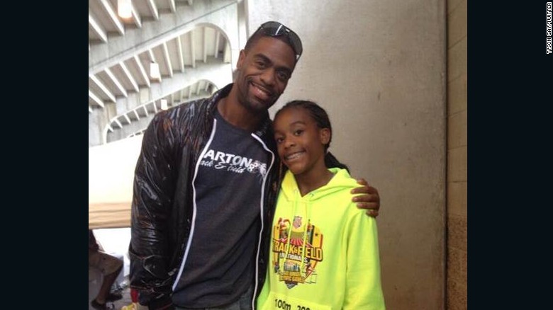 Tyson Gay poses with daughter Trinity in a photo he posted to his Twitter account in 2013. 