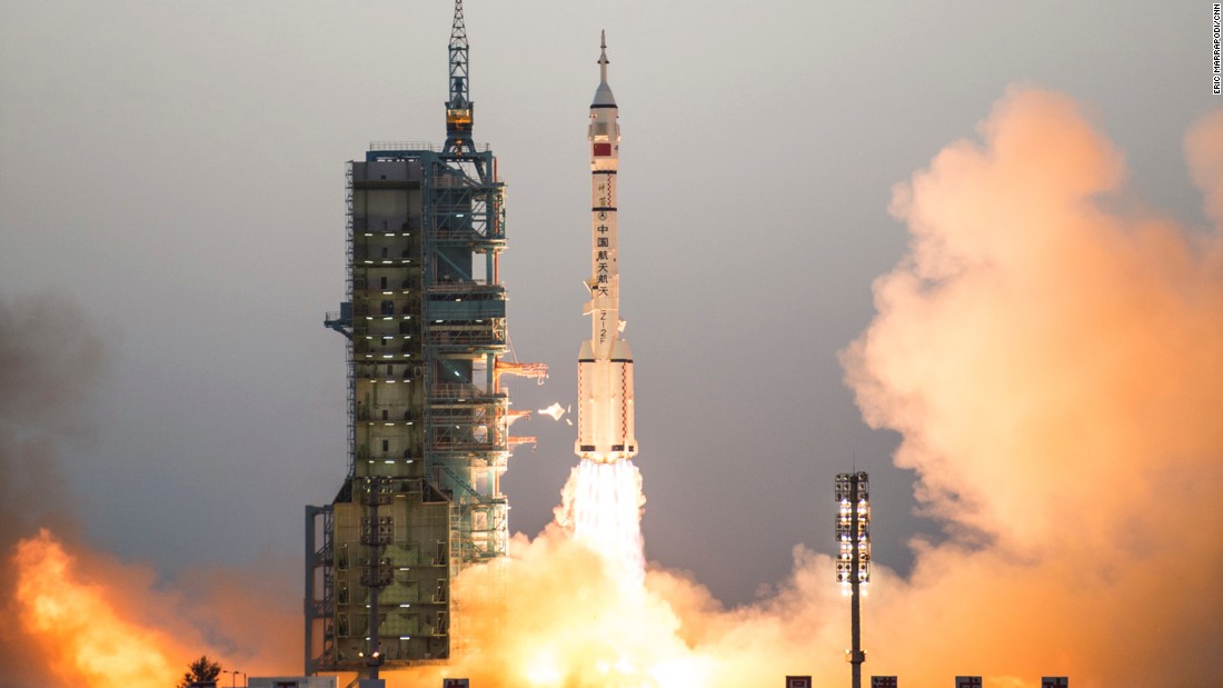 China spacecraft docks at space lab
