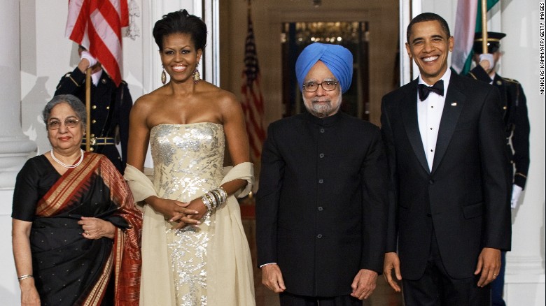US President Barack Obama and first lady Michelle Obama greet Indian Prime Minister Manmohan Singh and his wife Gursharan Kaur at the White House on November 24, 2009, as the Obamas host their first state dinner.     