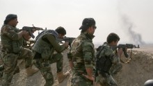Members of the Iraqi Kurdish Regional Government take aim near the town of Bartella on October 18.