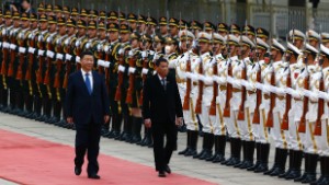 BEIJING, CHINA - OCTOBER 20: President of the Philippines Rodrigo Duterte and Chinese President Xi Jinping review the honor guard as they attend a welcoming ceremony at the Great Hall of the People on October 20, 2016 in Beijing, China. Philippine President Rodrigo Duterte is on a four-day state visit to China, his first since taking power in late June, with the aim of improving bilateral relations.  (Photo by Thomas Peter-Pool/Getty Images)