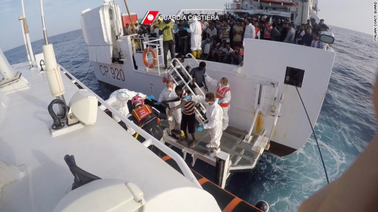 African migrants who were rescued in the Mediterranean Sea are transferred from the Italian Coast Guard ship Gregoretti to a smaller dinghy to be taken to land on October, 21. 