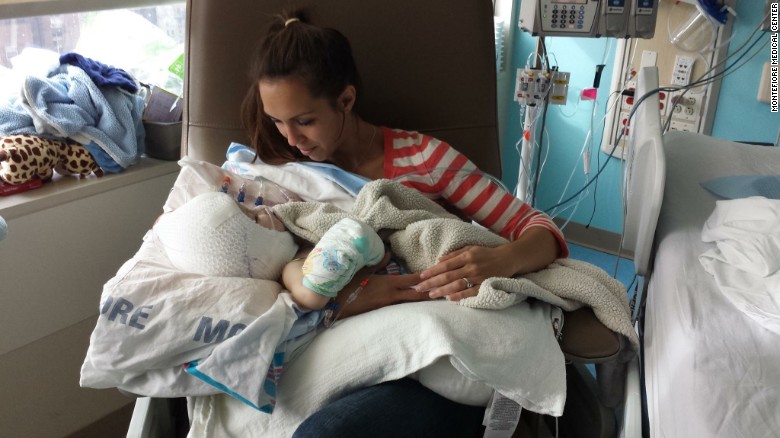 Nicole McDonald holds her son Jadon for the first time.