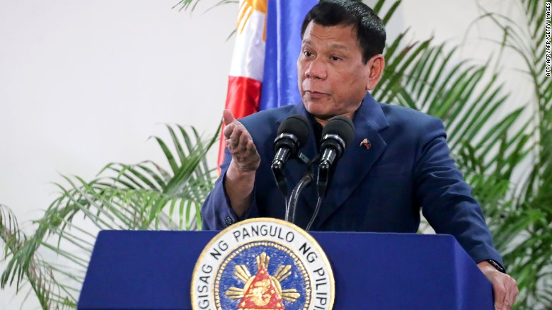 Philippine President Rodrigo Duterte gestures as he speaks at the Davao International Airport after arrving back from a state visit to Brunei and China on October 22, 2016. Philippine President Rodrigo Duterte said on October 22 he would not sever his nation&#39;s alliance with the United States, as he clarified his announcement that he planned to &quot;separate&quot;. / AFP / MANMAN DEJETO (Photo credit should read MANMAN DEJETO/AFP/Getty Images)