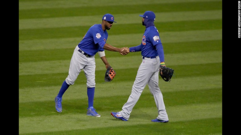 Dexter Fowler of the Chicago Cubs celebrates with Jason Heyward after defeating the Cleveland Indians 5-1 in Game 2 of the 2016 World Series on Wednesday, October 26, 2016 in Cleveland, Ohio.