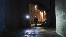 Rescuers and residents inspect earthquake damage in Visso.