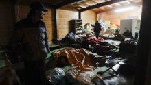 Residents prepare to spend the night in makeshift shelters in Visso.