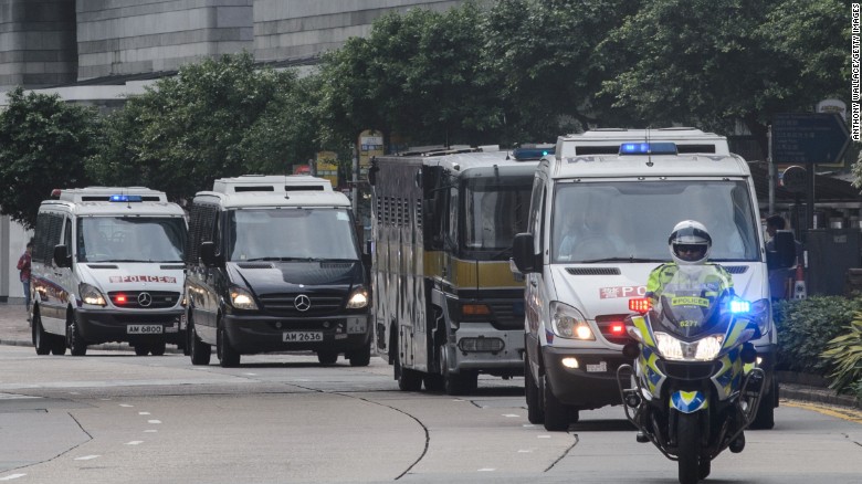 A prison van (3rd vehicle from front) transporting British banker Rurik Jutting to the High Court in Hong Kong on Monday, October 31.