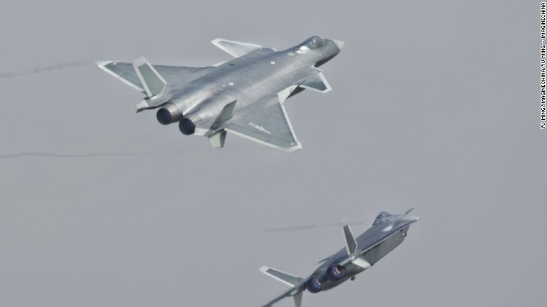 J-20 stealth fighters of the Bayi Aerobatic Team of PLA&#39;s (Peoples Liberation Army) Air Force perform on Tuesday in their first public appearance.