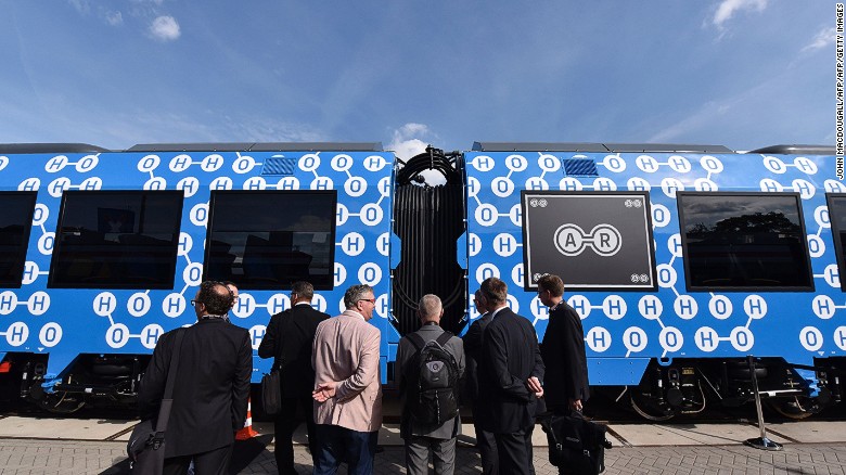 Visitors check out the Coradia iLint train after it was unveiled at Innotrans, the railway industry&#39;s largest trade fair, in Berlin on September 20, 2016.