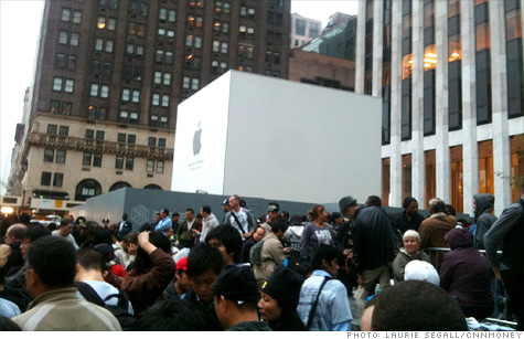Hundreds lined up overnight at Apple's NYC flagship store to buy the new iPhone 4S.