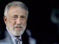 George Zimmer packs his suit and tie