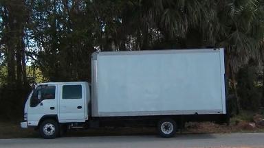 Truck blocks camera from showing Trump golfing