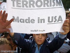 Palestinian refugee schoolboys in Damascus protest the U.S. attack in Syria, which called the strike barbaric.