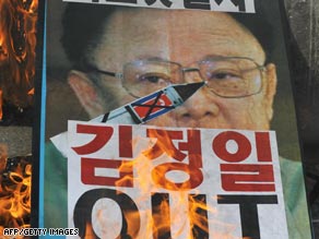 Conservative activists protest the North Korean rocket launch on Sunday in Seoul, South Korea.