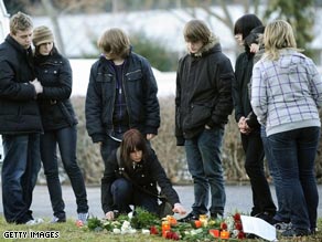 Teenagers lay flowers at the school where Tim Kretschmer began his rampage.