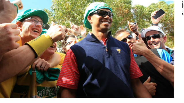 Tiger Woods is congratulated by fans after his winning putt ensured the United States retained the Presidents Cup.