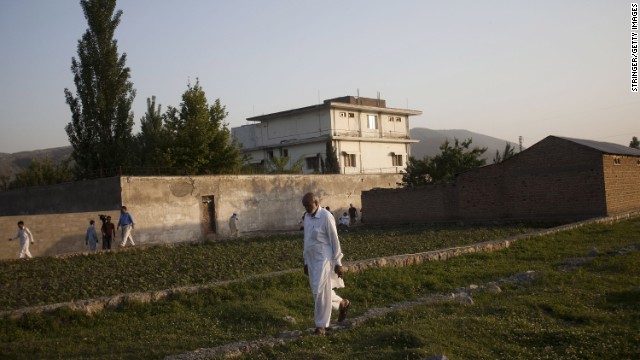  A local man walks through a field near Osama Bin Laden's compound, where he was killed during a raid by U.S. special forces a year ago.