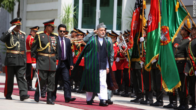 Afghan President Hamid Karzai attends the graduation ceremony of 500 students from the National Police Academy in July.