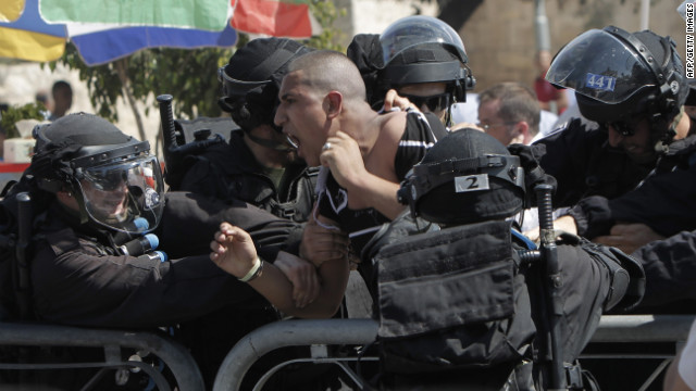 Israeli police arrest a Palestinian protester on Friday.