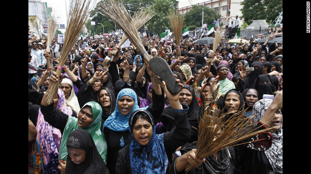Muslim protesters holding shoes and brooms shout anti-U.S. slogans on Saturday during a protest against the film they consider blasphemous to Islam near the U.S. Consulate-General in Chennai, India.