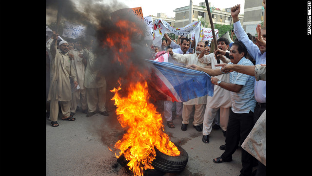 Pakistani Muslims burn a U.S. flag during a protest rally in Islamabad on Saturday. The Pakistani Taliban on Saturday issued a call to young Muslims worldwide and within the country to rise up against an anti-Islam movie. 