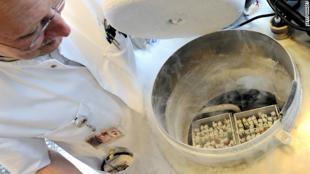 A technician opens a vessel containing women's frozen egg cells.