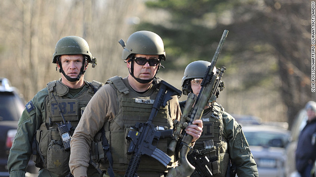 FBI SWAT team members walk along Dickinson Drive near Sandy Hook Elementary School on December 14.