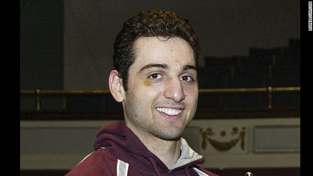 Police say the dead suspect, <a href='http://www.cnn.com/2013/04/21/us/tamerlan-tsarnaev-timeline/index.html'>Tamerlan Tsarnaev</a>, is the man the FBI identified as Suspect 1. He was killed during the shootout with police in Watertown, Massachusetts, early April 19. He is pictured here at the 2010 New England Golden Gloves.