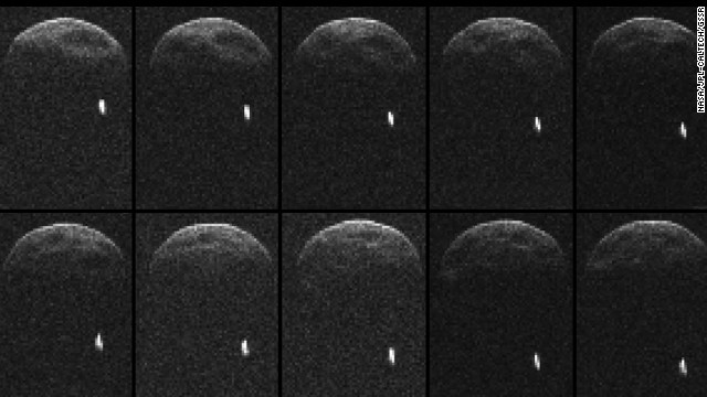 Asteroid 1998 QE2 about 3.75 million miles from Earth. The white dot is the moon, or satellite, orbiting the asteroid.