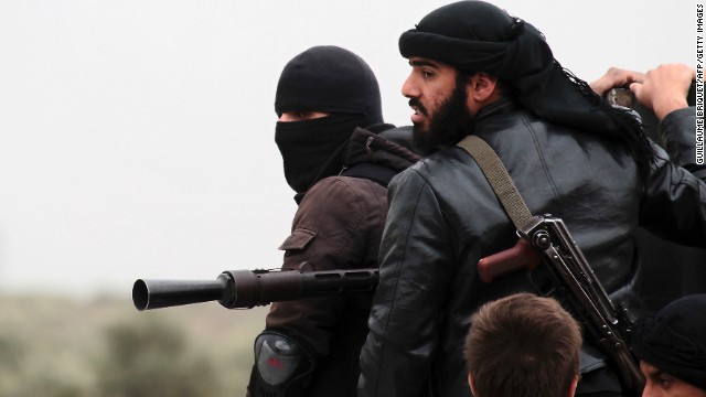 Al Nusra fighters stand ready to fight Syrian regime forces near Aleppo in April. Al Nusra has pledged allegiance to al Qaeda.