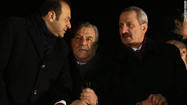 Turkish Cabinet ministers Egemen Bagis, left, Muammer Guler and Zafer Caglayan await the arrival Tuesday of Prime Minister Recep Tayyip Erdogan at the Ankara airport. Guler, Caglayan and Erdogan Bayraktar resigned Wednesday from the Cabinet.