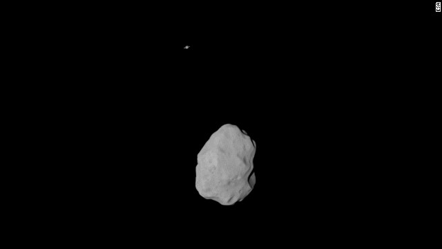 Look closely at the top of this picture. See that dot? That's Saturn. Rosetta snapped the picture of asteroid Lutetia and captured Saturn in the background.