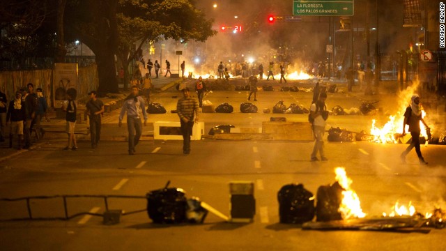 Barricades set up by opposition protesters block a road in the Altamira neighborhood of Caracas, Venezuela, on Thursday, February 20.