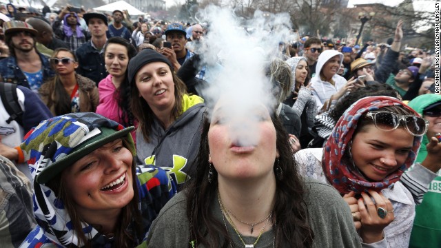 Partygoers dance and smoke pot on the first of two days of The Official 420 Rally annual marijuana festival in Denver on Saturday, April 19. This is the first year of the festival where it has been legal to sell marijuana for recreational use in Colorado. <a data-cke-saved-href='https://www.cnn.com/2013/04/20/opinion/reiman-marijuana-day/' href='https://www.cnn.com/2013/04/20/opinion/reiman-marijuana-day/' target='_blank'>420 is a once clandestine term used in pot culture to refer to marijuana. </a>